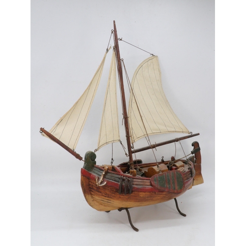 317 - A model of a wooden boat on stand