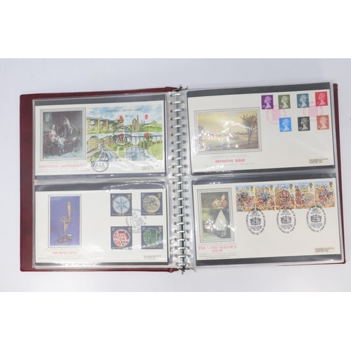 338 - A Stanley Gibbons Devon album of commonwealth and GB together with FDC silk issues from Feb 82 to Ju... 