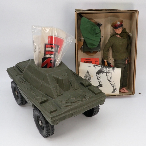 123 - A boxed Action Man field commander and field radio in original box together with a Palitoy adverture... 