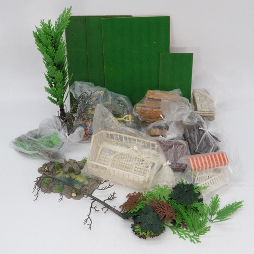 141 - Britains Floral garden items including bases, trees, plants, planters, flowers etc.