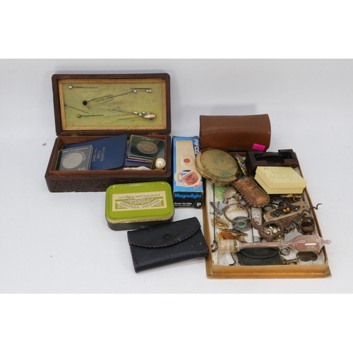 150 - A carton of assorted collectables to include commemorative coins, hat pins, military buttons and bad... 