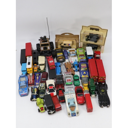 156 - A large carton of assorted vintage to later diecast vehicles.