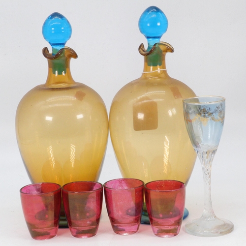 66 - A pair of glass decanters, together with four cranberry liquer glasses and another glass etc (approx... 