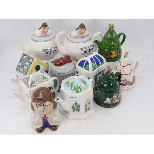 547 - Three Wade boxed Christmas teapots together with several other teapots, Tetley and others.