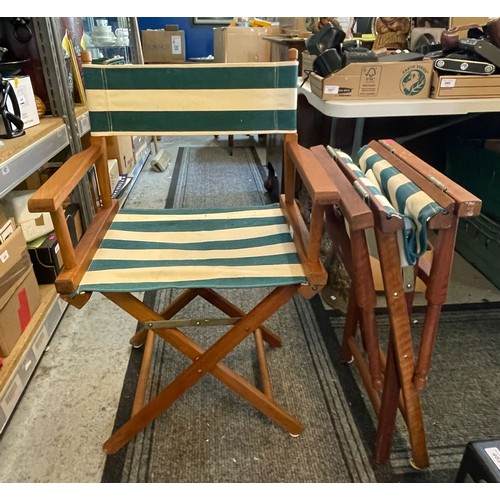 377 - A pair of folding teak garden directors chairs