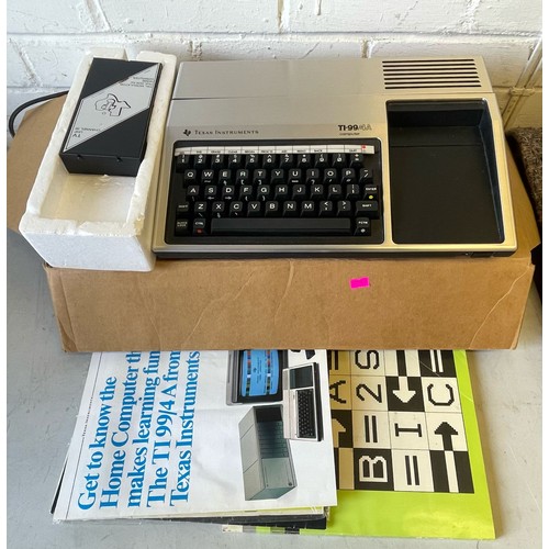 535 - Texas TI-99/4a computer in original packaging together with another in brown plain box, with a large... 