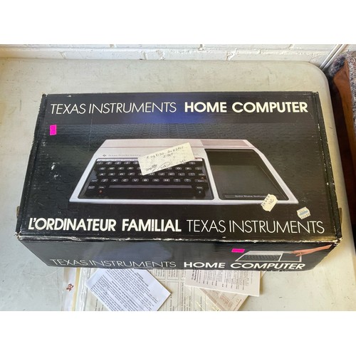 535 - Texas TI-99/4a computer in original packaging together with another in brown plain box, with a large... 