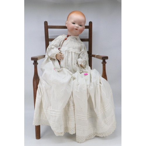 260 - Armand Marseille Germany large porcelain headed doll, and elbow chair