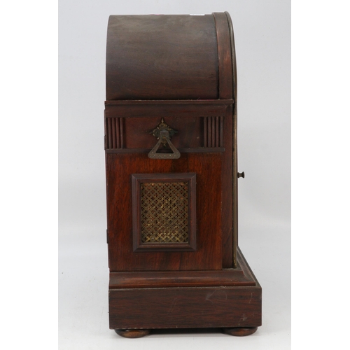 500 - Antique Mahogany mantle clock with arch dial with pendulum and key