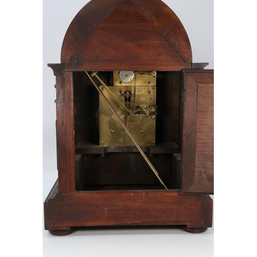 500 - Antique Mahogany mantle clock with arch dial with pendulum and key