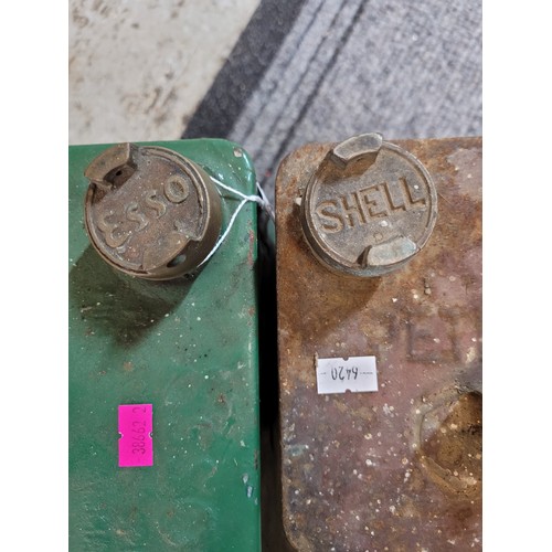 557 - Vintage Esso fuel can together with a shell similar