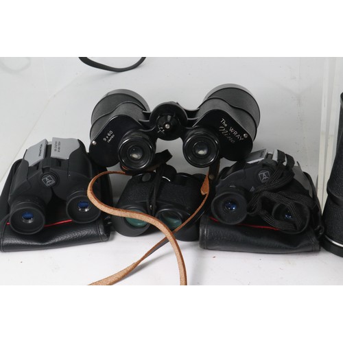 82 - Several pairs of assorted binoculars to include Bell & Howell, Pentax and Tasco etc