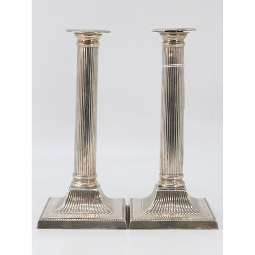 4 - Pair of silver hallmarked column candlesticks, approx. 24cm high and weighted (approx. overall weigh... 