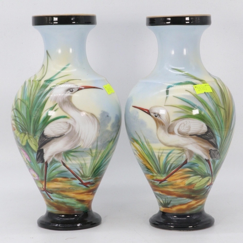 50 - A pair of porcelain vases hand painted with storks