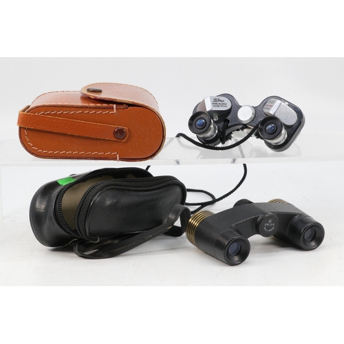 102 - A pair of small Russian binoculars together with Le Gram 8 x 20 small binoculars with leather case