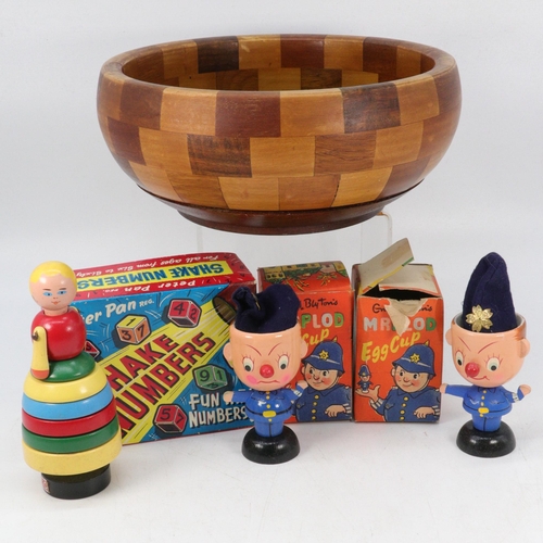 105 - Two boxed noddy egg cups, Brio? Stacking doll and a wooden bowl etc