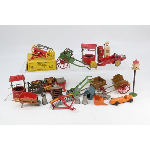 110 - Dinky toys 324 hay rake in original box together with other farm implements including Britains trap,... 