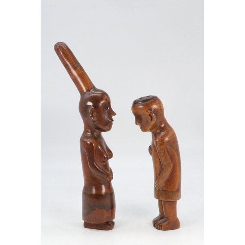 166 - Two hand carved tribal statues, male and female