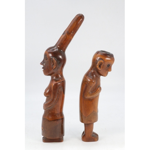 166 - Two hand carved tribal statues, male and female