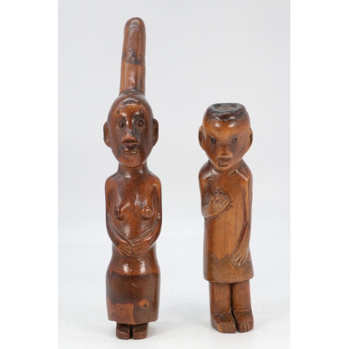 166 - Two hand carved tribal statues, male and female