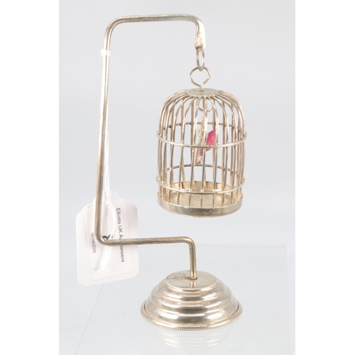 8 - An Egyptian silver bird in a cage on stand (approx. weight 80g)