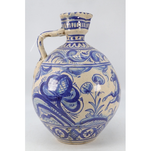 85 - Antique continental stoneware jug decorated with shades of blue floral patterns, leaping horse and a... 