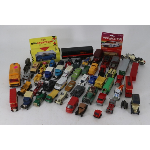 55 - A carton of assorted diecast vehicles, mostly playworn.