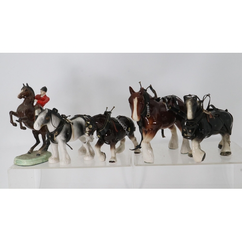 69 - Beswick huntsman on rearing horse (repaired leg) together with a quantity of ceramic shire horses