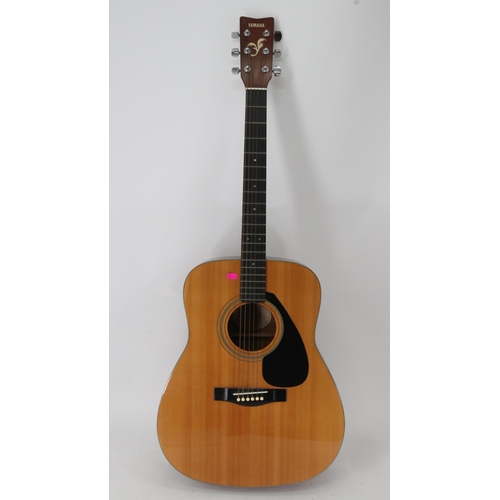 100 - A Yamaha FG-410A acoustic guitar with Seiko tuner, stings and books.