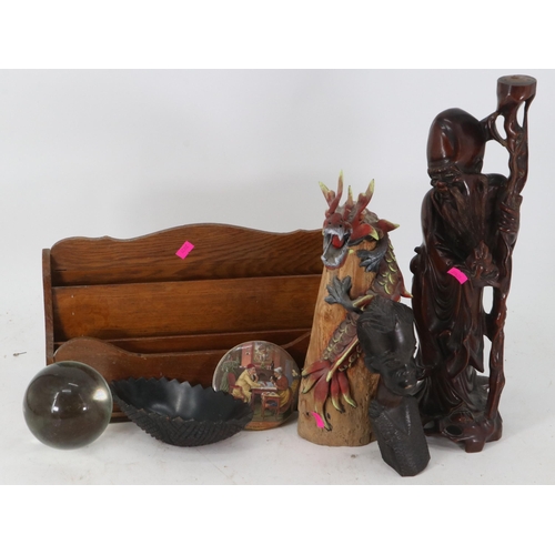 166 - Carved oriental figure, other wooden items including a Dragon and a letter rack