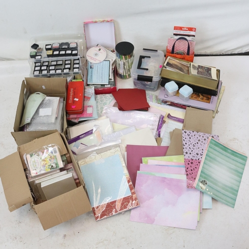 207 - A collection of crafting supplies to include card stock, ink blocks etc..