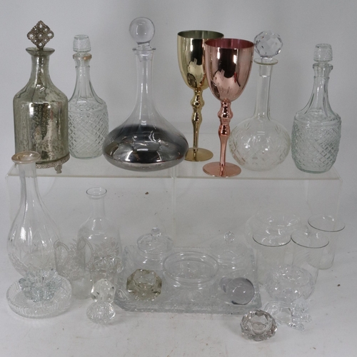 217 - A collection of assorted glassware to include decanters, cut glass dressing table items etc..