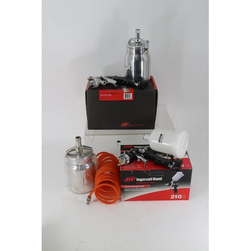 264 - Two new and boxed Ingersoll-
Rand spray guns,, extra hose and Devilbiss canister.