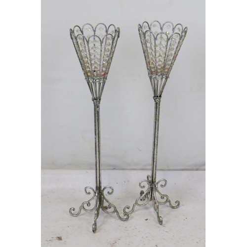 288 - A pair of contemporary metal candlesticks measuring approx. 69cm tall.