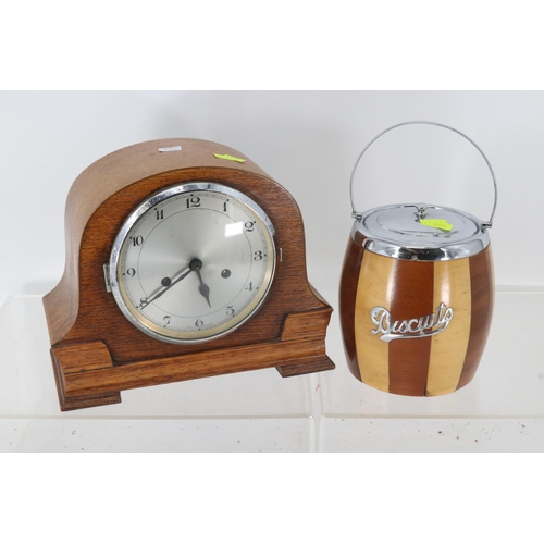 121A - Oak cased mantle clock with pendulum and key, together with a wooden biscuit barrel