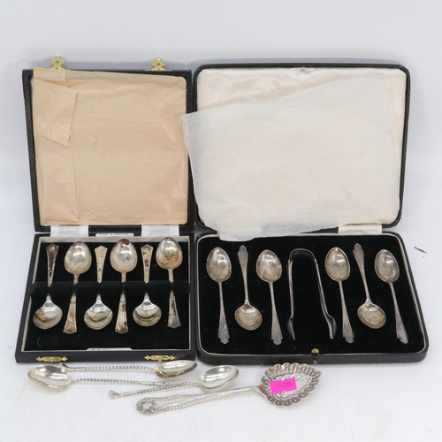 42 - Cased set of six silver hallmarked spoons together with another set of six and sugar tongs three gol... 