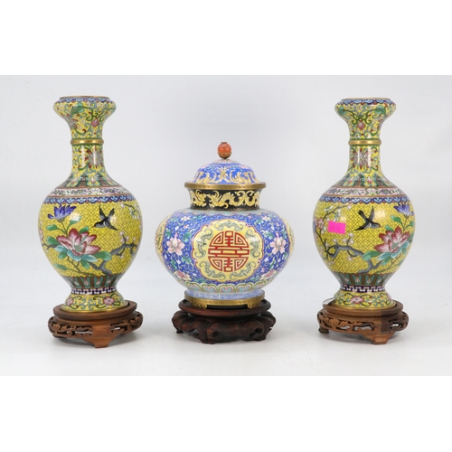 87 - Pair of Cloisonne vases on wooden plinths and a similar ginger jar. Vases measure approx. 23.5cm and... 