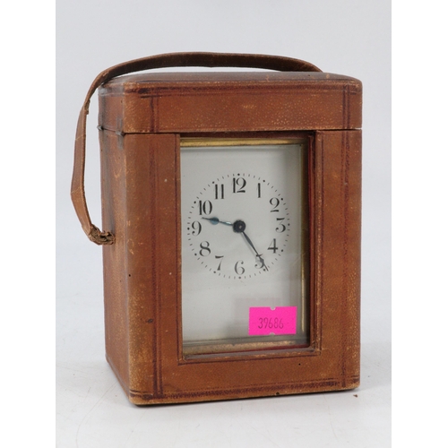 126 - Antique French brass carriage clock. with travel case.