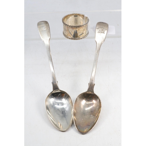 28 - Two silver tablespoons together with a napkin ring