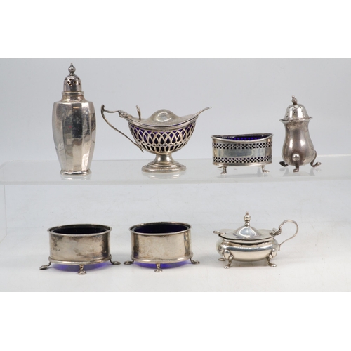 33 - Pair of silver salts and one other of pierced design all with blue liners, two mustart pots with spo... 