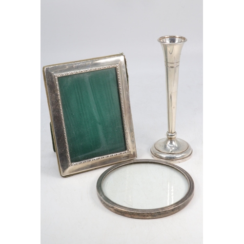 51 - Silver hallmarked bud vase together with a rectangular silver hallmarked photo frame and a silver ha... 