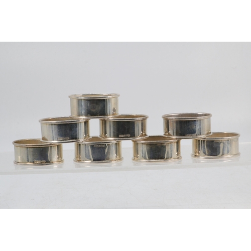 55 - 8 oval silver napkin rings in individual boxes (approx 108g)