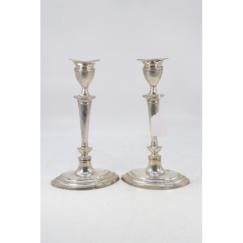 6 - Pair of silver hallmarked weighted candle sticks with removable sconces measures approx. 24cm tall, ... 