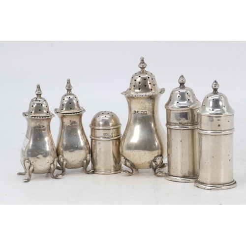 26 - Two pairs of silver pepperettes (one pair with blue glass liners together with two other silver pepp... 