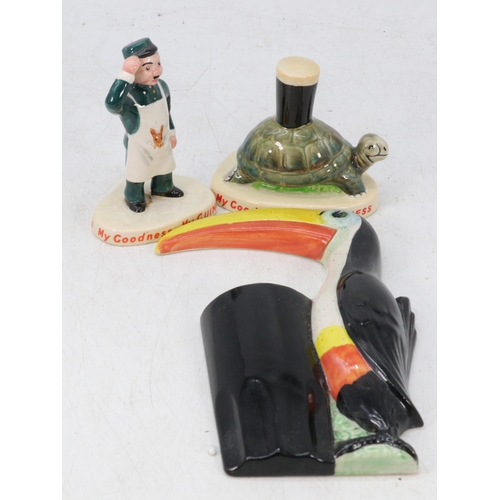 103 - A Carlton ware Guinness tortoise figure another figure, and a blank toucan wall plaque