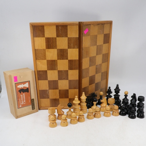 610 - Selection of chess pieces to include Boxwood chessmen together with a folding chess board