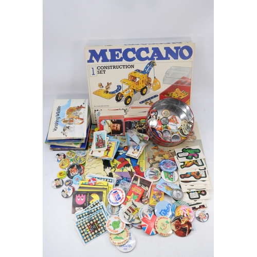 612 - Selection of vintage badges together with a quantity of football cards other stickers, Cigarette car... 