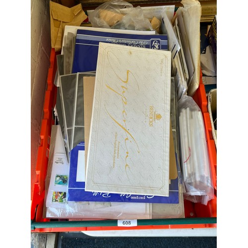 608 - A carton containing a quantity of first day covers, PHQ cards, accessories etc