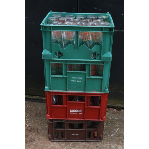 1B - Four crates of advertising milk bottles