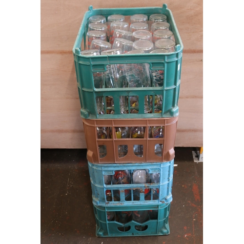 2 - Four crates of advertising milk bottles